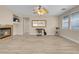 Spacious living room featuring a cozy fireplace and plenty of natural light at 11074 Caramel Crest Ct, Las Vegas, NV 89135