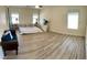 Expansive main bedroom has plenty of natural light and wood-look flooring at 11074 Caramel Crest Ct, Las Vegas, NV 89135