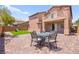 Spacious backyard with brick pavers, a grassy area, a playset, and outdoor seating at 11274 Civita St, Las Vegas, NV 89141