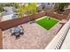 Aerial view of backyard featuring a patio, an artificial lawn, and a play area at 11274 Civita St, Las Vegas, NV 89141