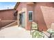 Balcony with sliding door access, comfortable seating, and wrought iron railing at 11274 Civita St, Las Vegas, NV 89141