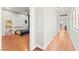 Bedroom with hardwood floors, ceiling fan, and a view into the hallway at 11274 Civita St, Las Vegas, NV 89141