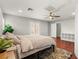 Spacious bedroom with wood floors, ceiling fan, and access to a private outdoor space at 11274 Civita St, Las Vegas, NV 89141