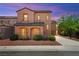 Charming two-story stucco home with a tile roof and well-manicured landscaping creating a welcoming curb appeal at 11274 Civita St, Las Vegas, NV 89141
