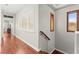 A bright hallway with wood floors and stairway at 11274 Civita St, Las Vegas, NV 89141