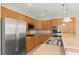 A well-equipped kitchen with stainless steel appliances and granite countertops at 11274 Civita St, Las Vegas, NV 89141