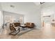 Bright living room features neutral walls, tiled flooring, and modern furnishings with window shutters at 11274 Civita St, Las Vegas, NV 89141