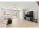 Bright living room with sliding glass doors and neutral tones for a relaxing atmosphere at 11274 Civita St, Las Vegas, NV 89141