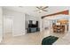 Bright and open living room featuring a ceiling fan and decorative wooden beam at 11274 Civita St, Las Vegas, NV 89141