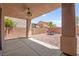 Covered patio features a ceiling fan, brick flooring, and space for outdoor seating at 11274 Civita St, Las Vegas, NV 89141