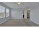 Light and airy bedroom with neutral carpet and two bright windows at 1130 Blissful Plains Ave, North Las Vegas, NV 89086