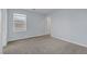 Cozy bedroom with neutral carpet, light blue walls, and a window bringing in natural light at 1130 Blissful Plains Ave, North Las Vegas, NV 89086