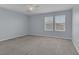 Bright bedroom with neutral carpet and dual windows at 1130 Blissful Plains Ave, North Las Vegas, NV 89086