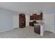 Spacious kitchen area with stainless steel appliances, granite countertops and tile flooring at 1130 Blissful Plains Ave, North Las Vegas, NV 89086