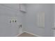 Functional laundry room with hookups, utility connections, and overhead wire rack at 1130 Blissful Plains Ave, North Las Vegas, NV 89086