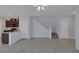 Open-concept living area featuring tile floors, neutral paint, and a staircase leading to the second level at 1130 Blissful Plains Ave, North Las Vegas, NV 89086