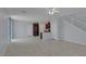 Spacious living room with tile floors and open floor plan to the kitchen area, perfect for entertaining at 1130 Blissful Plains Ave, North Las Vegas, NV 89086