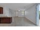 Spacious living room with tile flooring, ceiling fan, and natural light at 1130 Blissful Plains Ave, North Las Vegas, NV 89086