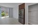 Bright open area with pantry, stainless steel refrigerator, and sliding glass doors at 1130 Blissful Plains Ave, North Las Vegas, NV 89086