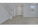 Open floor plan with tile flooring, neutral paint and staircase; bright and airy feel at 1130 Blissful Plains Ave, North Las Vegas, NV 89086