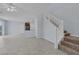 Bright living space features tile flooring, stairs to the second floor, and an open floor plan at 1130 Blissful Plains Ave, North Las Vegas, NV 89086