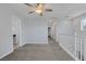 Upstairs loft area with neutral carpet, ceiling fan, and access to bedrooms at 1130 Blissful Plains Ave, North Las Vegas, NV 89086