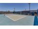 Community tennis court with well-maintained net and fenced perimeter at 1130 Blissful Plains Ave, North Las Vegas, NV 89086