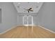 Large bedroom featuring a ceiling fan, hardwood floors, and stylish barn doors that let in lots of light at 1190 E Carson Ave, Las Vegas, NV 89101