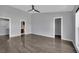 Large bedroom with hardwood floors and a view of the ensuite bathroom and walk in closet at 1190 E Carson Ave, Las Vegas, NV 89101