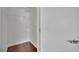 Walk in closet with custom white wire shelving, light gray walls and polished concrete floors at 1190 E Carson Ave, Las Vegas, NV 89101