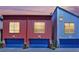 Stylish townhomes showcasing modern architecture with vibrant, complementary colors and private garage entrances at 1190 E Carson Ave, Las Vegas, NV 89101