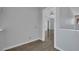 Hallway features light gray walls, white trim, and wood look floors that run throughout the home at 1190 E Carson Ave, Las Vegas, NV 89101