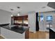 Updated kitchen features stainless steel appliances, modern countertops, and contemporary lighting at 1190 E Carson Ave, Las Vegas, NV 89101
