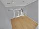 Bright, open living space with hardwood floors and a ceiling fan at 1190 E Carson Ave, Las Vegas, NV 89101
