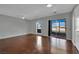 This living room is spacious with great light, ceiling fan, and sliding glass door at 1190 E Carson Ave, Las Vegas, NV 89101