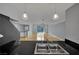 Modern living space with views from kitchen sink, hardwood floors, and contemporary lighting at 1190 E Carson Ave, Las Vegas, NV 89101