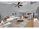 Bright living room with vaulted ceilings, plush seating, and abundant natural light at 1190 E Carson Ave, Las Vegas, NV 89101