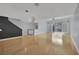Bright, open living space with hardwood floors, a modern light fixture, and sliding doors leading to outdoor space at 1190 E Carson Ave, Las Vegas, NV 89101