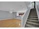Spacious living room with hardwood floors, modern light fixture, and staircase access to the upper level at 1190 E Carson Ave, Las Vegas, NV 89101