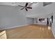 Open concept living space with high ceilings, ceiling fan, and hardwood floors, great for entertaining guests at 1190 E Carson Ave, Las Vegas, NV 89101
