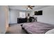 Bedroom with modern black furniture, television, and neutral walls for a comfortable and inviting space at 1200 Mission View Ct, Henderson, NV 89002