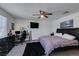 Bedroom with desk area, wall-mounted TV, and a neutral color palette for a versatile space at 1200 Mission View Ct, Henderson, NV 89002