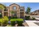 Inviting two-story townhome with a well-maintained lawn, lovely landscaping, and an attractive front entrance at 1200 Mission View Ct, Henderson, NV 89002