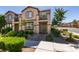 Charming two-story home featuring a well-maintained lawn, beautiful landscaping, and an inviting entryway at 1200 Mission View Ct, Henderson, NV 89002
