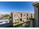 Exterior of townhomes with desert landscaping, patios, and well-maintained grounds at 1200 Mission View Ct, Henderson, NV 89002