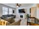 Bright living room featuring a fireplace, tile flooring and comfortable seating at 1200 Mission View Ct, Henderson, NV 89002