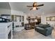 Open floor plan with living room, kitchen, and dining area; tile flooring at 1200 Mission View Ct, Henderson, NV 89002