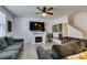 Bright living room featuring a fireplace, tile flooring and comfortable seating at 1200 Mission View Ct, Henderson, NV 89002