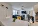 Bright living room with tile floors, gray sofa and chairs, and white fireplace at 1200 Mission View Ct, Henderson, NV 89002