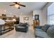 Open floor plan with living room, kitchen, and dining area; tile flooring at 1200 Mission View Ct, Henderson, NV 89002